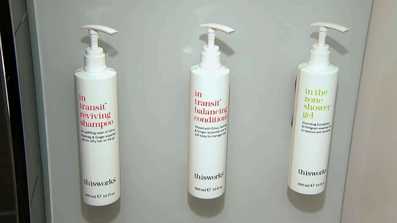 Photo of little shampoo, conditioner and shower gel bottles