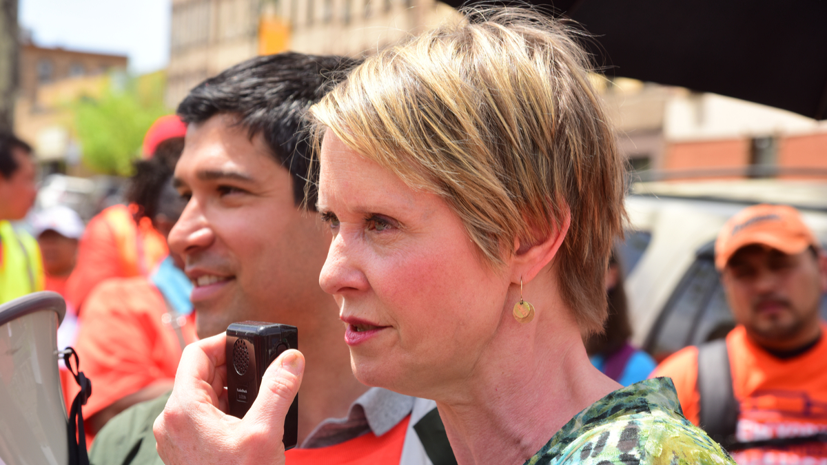 Picture of NYC Council member Carlos Menchaca and New York gubernatorial candidate Cynthia Nixon protesting ICE raids