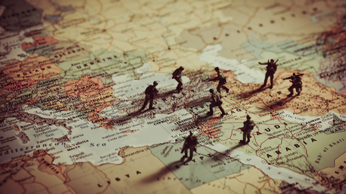 Photo Illustration of Toy Soldiers on a map of the Middle East.