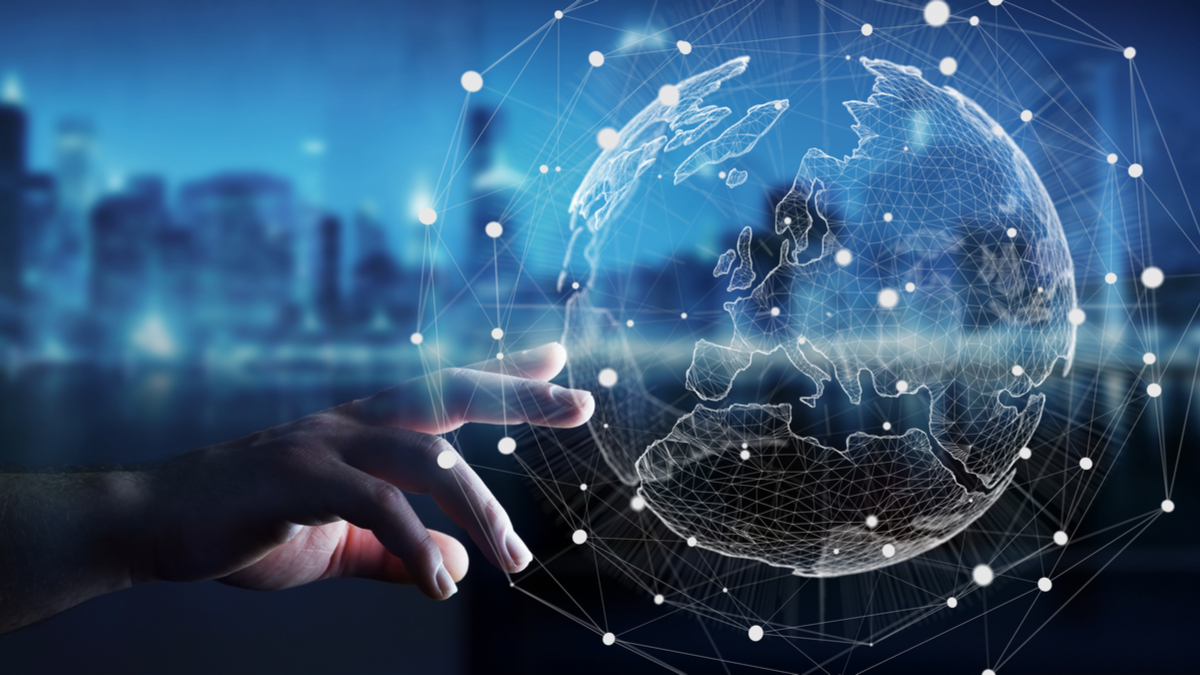 Photo Illustration of the world at the fingertips of a businessman