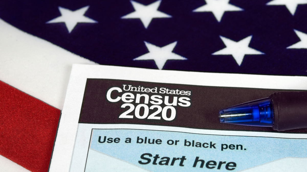 Photo illustration of American flag and 2020 census form