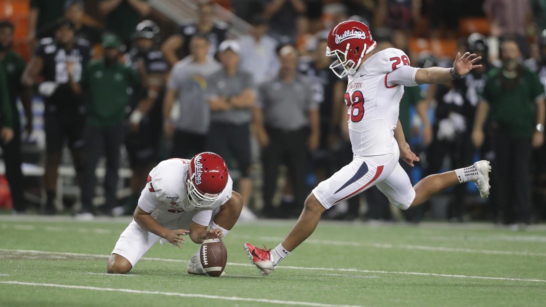 Photo of Cesar Silva kicking a field goal