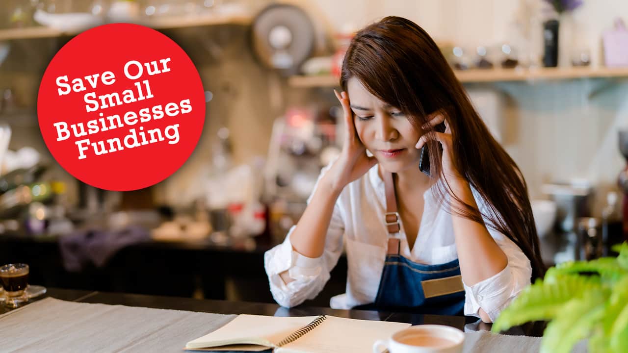 Photo of a coffee shop owner dealing with financial setbacks from COVID-10