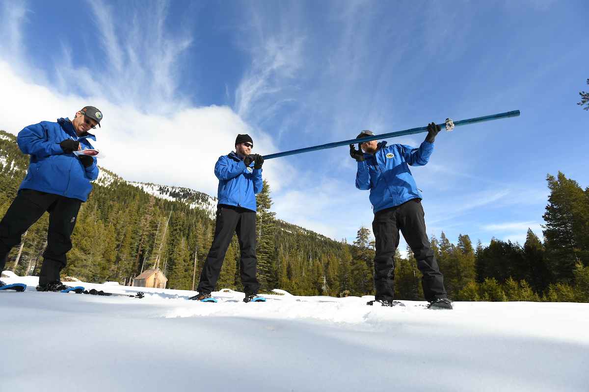Photo of three snow survey members
