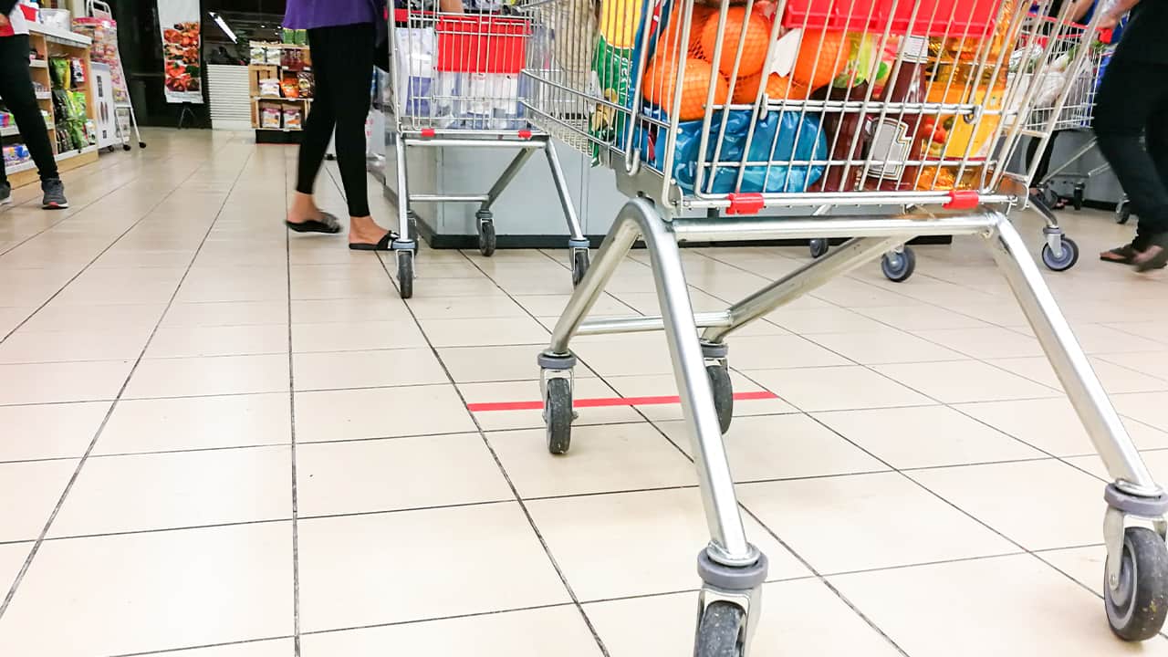 Photo of grocery baskets spaced apart to meet social distancing requirements