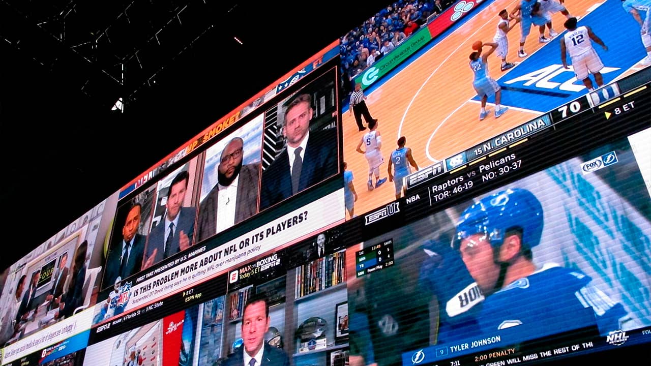 Photo of video screens in a betting lounge