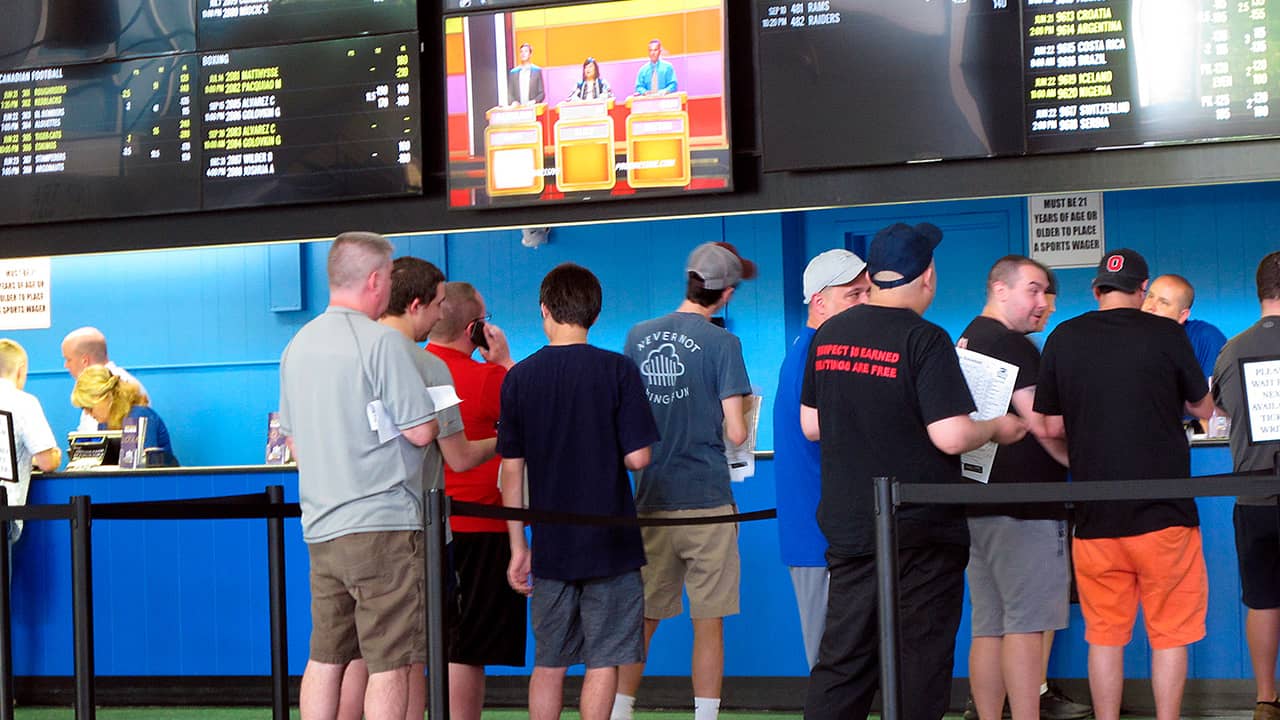 Photo of sports gamblers in line