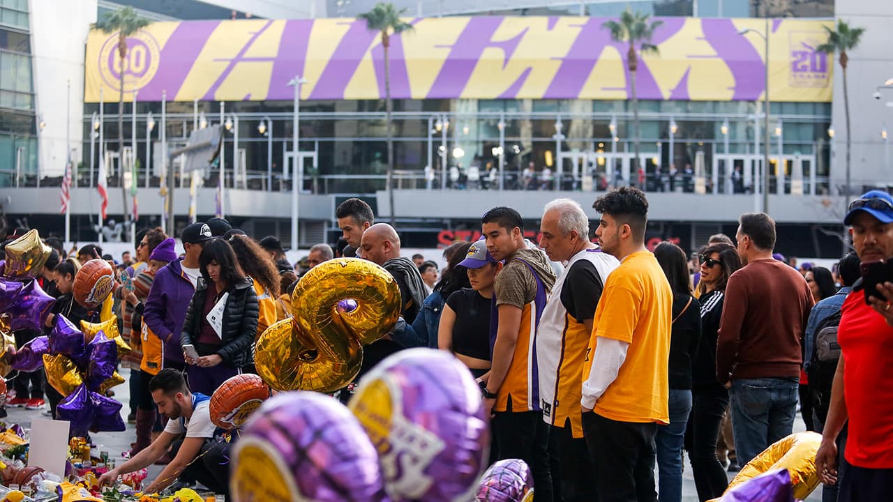 Photo of fans gathering to pay their respects in front of the Staples Center