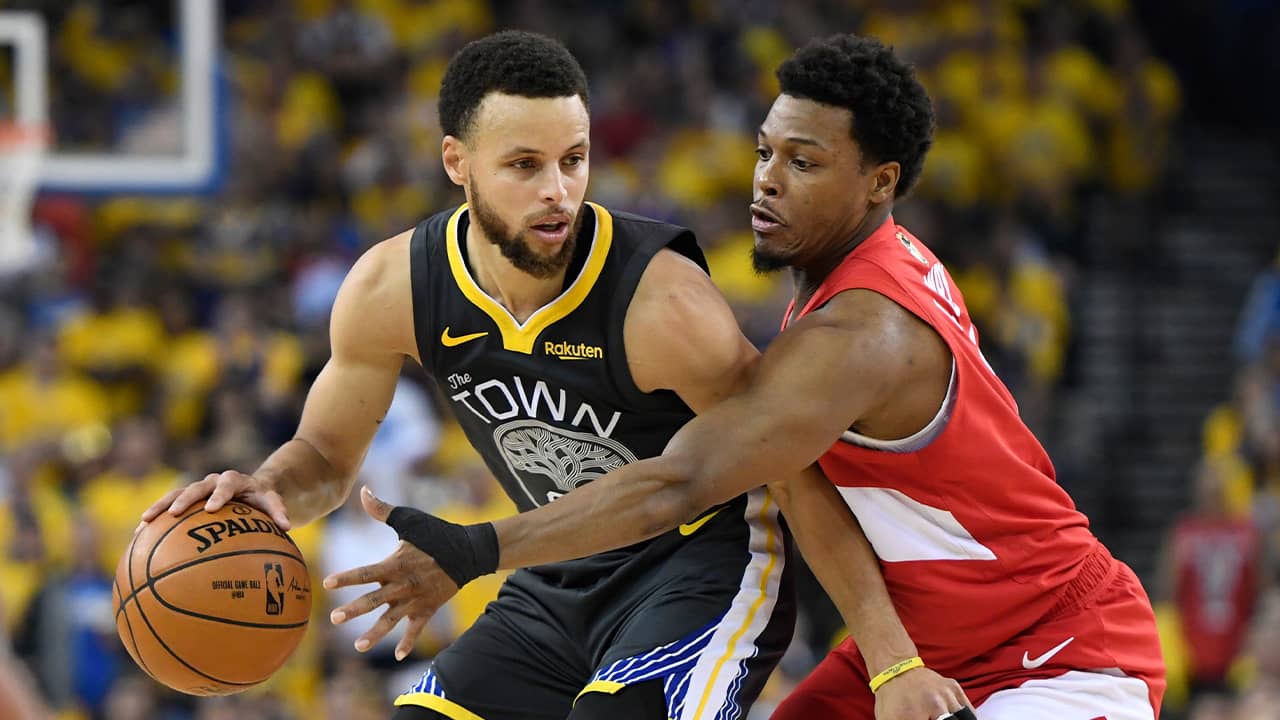 Photo of Golden State Warriors guard Stephen Curry and Toronto Raptors guard Kyle Lowry
