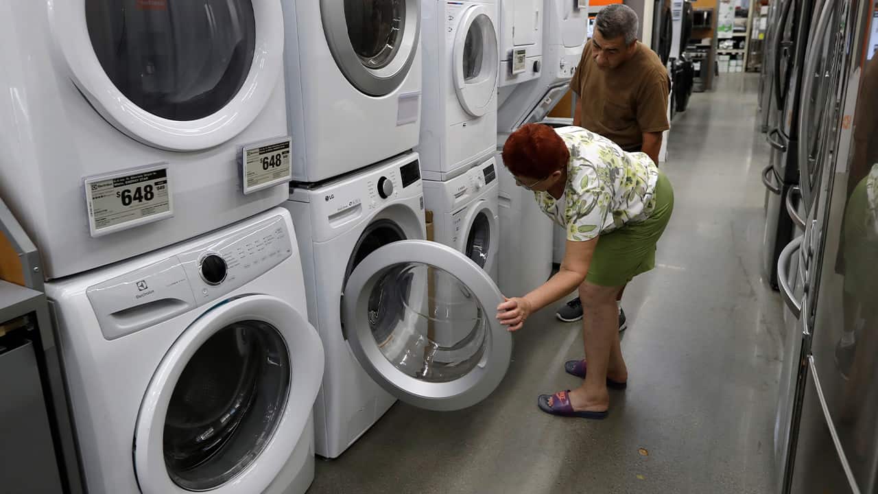 Photo of a woman examining washers