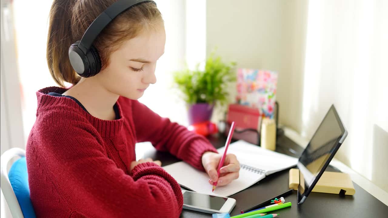 Image of a preteen student engaged in distance learning