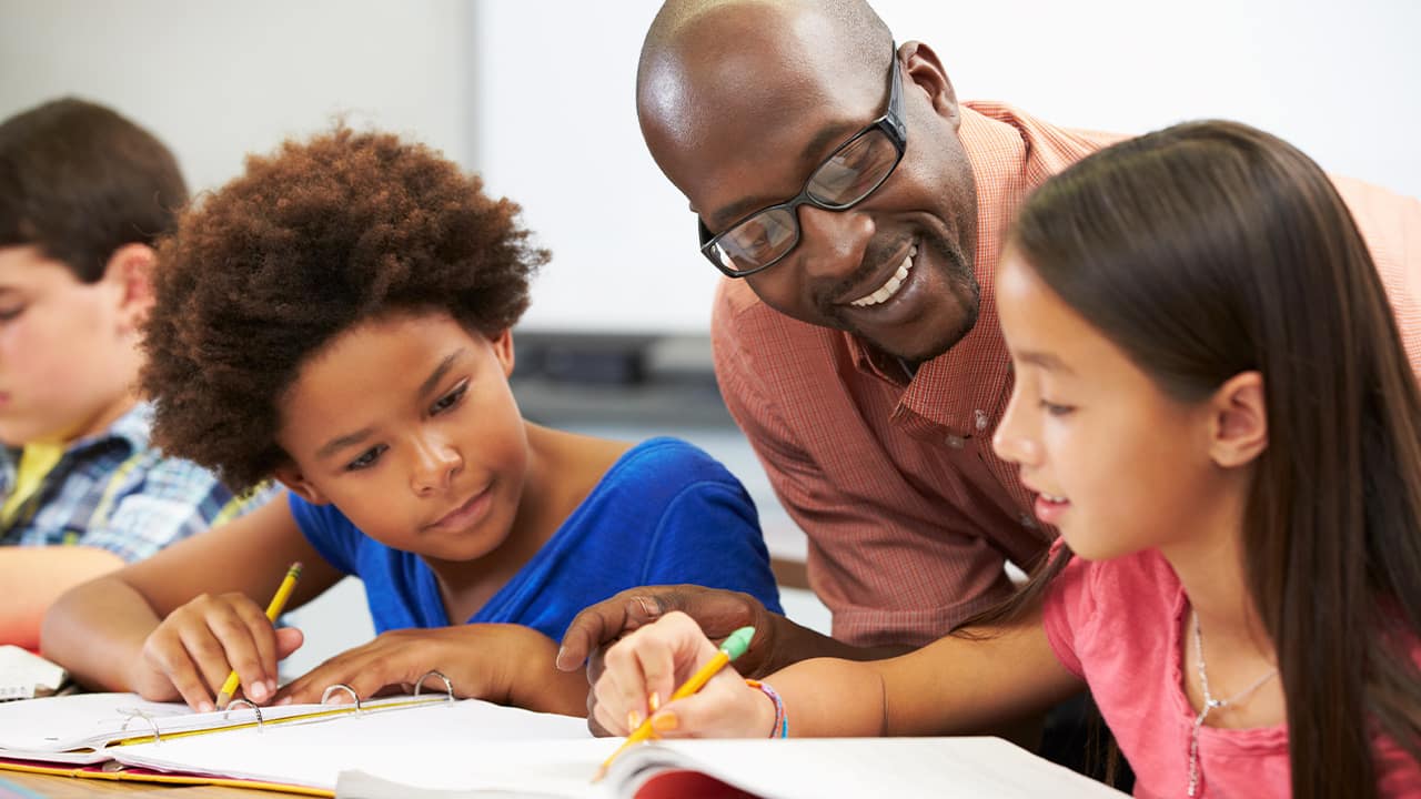 Photo of a teacher with students