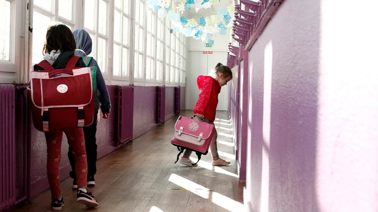Photo of a child walking to her classroom 