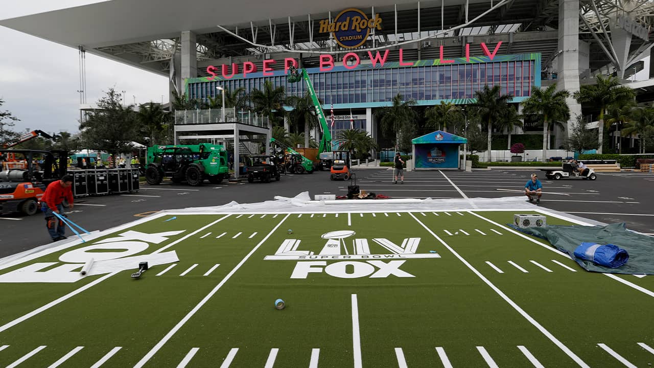 Photo of workers working on the setup outside of the Hard Rock Stadium in Miami Gardens 