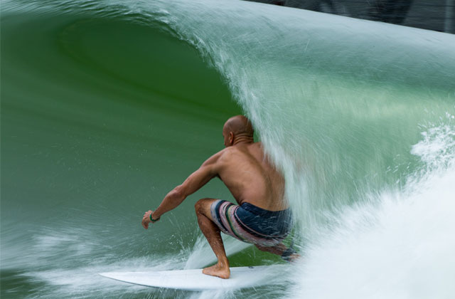 Photo of a man surfing at a wave park in Lemoore, California
