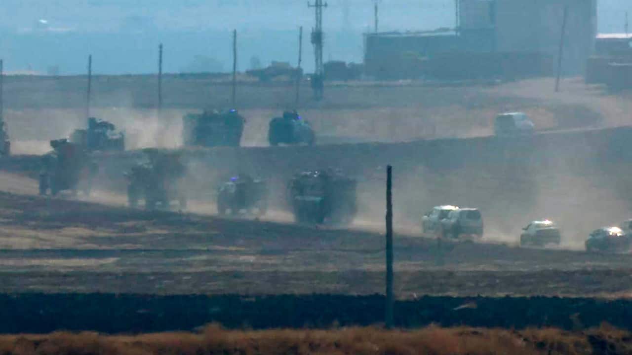 Photo of military vehicles moving in a convoy