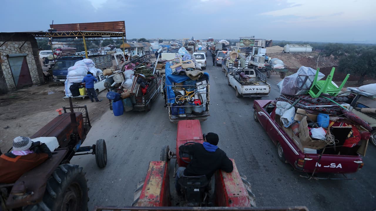 Photo of truckloads of civilians fleeing a Syrian military offensive