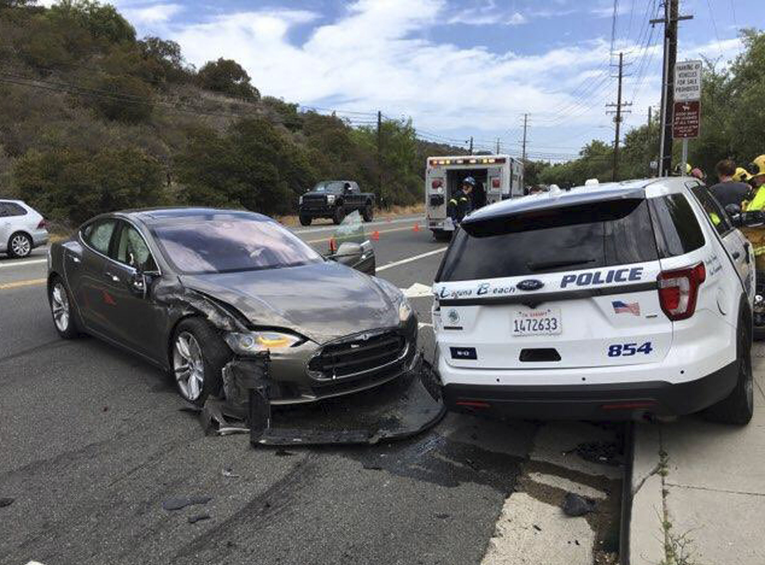 Crashed Tesla and police SUV in Laguna Beach, California