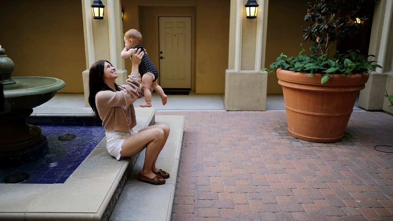 Photo of Keira Sumimoto playing with her daughter