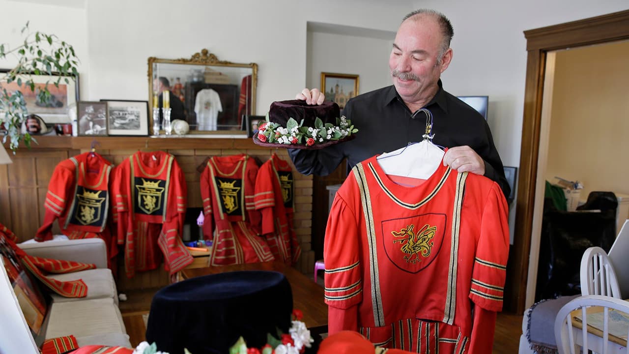Photo of Tom Sweeney with his jackets and hats