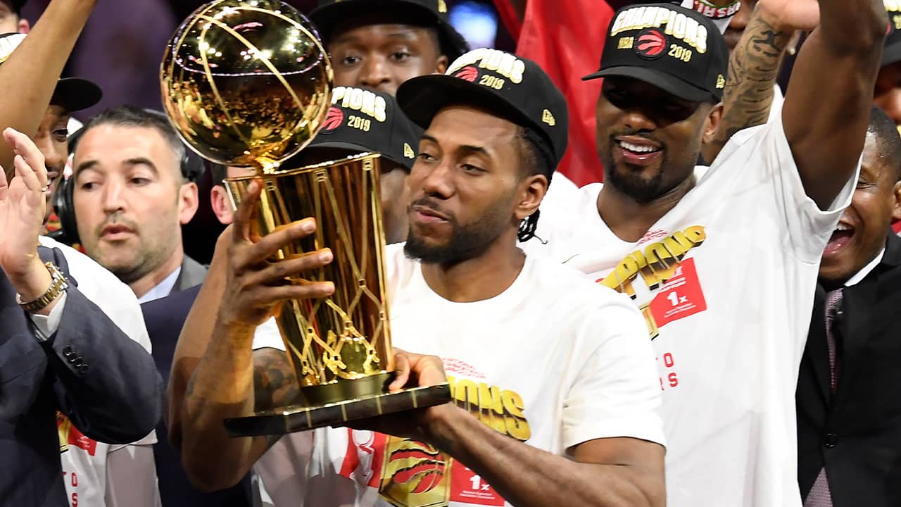 Photo of Kawhi Leonard holding the Larry O'Brien NBA Championship Trophy