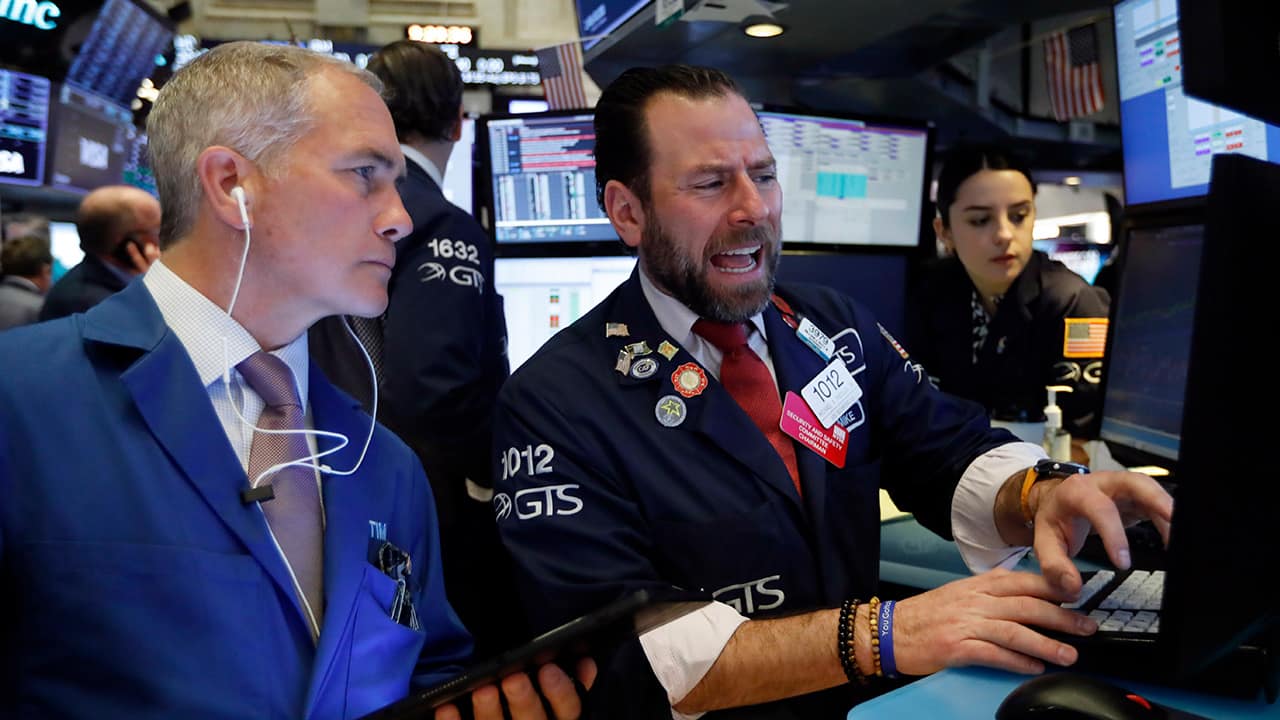 Photo of traders on the floor of the New York Stock Exchange