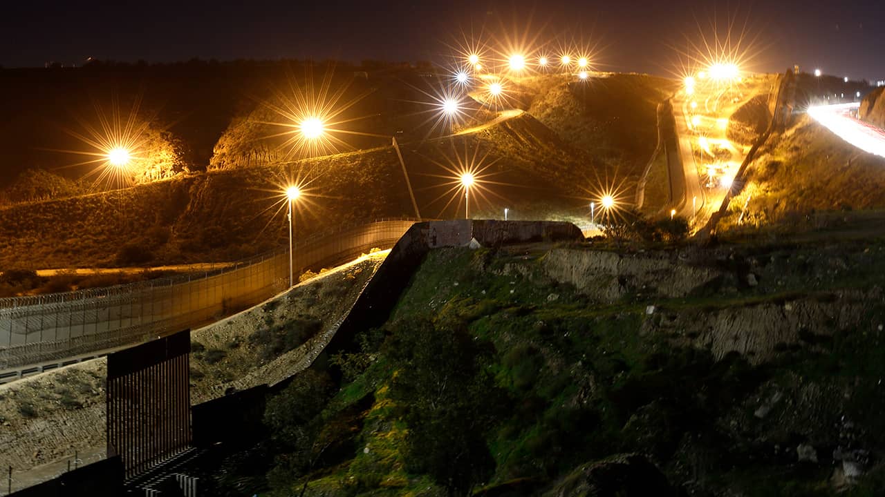 Photo of floodlights illuminating border walls
