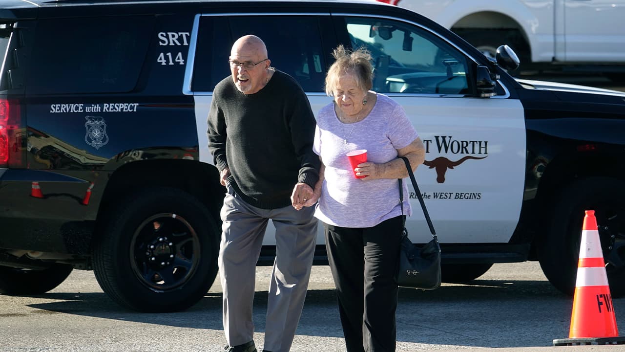 Photo of elderly couple walking from the West Freeway Church of Christ 