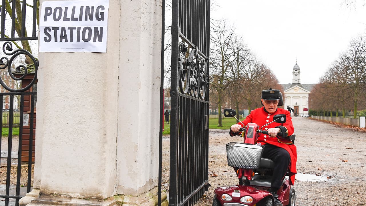 Photo of A Chelsea Pensioner leaving a polling station in London