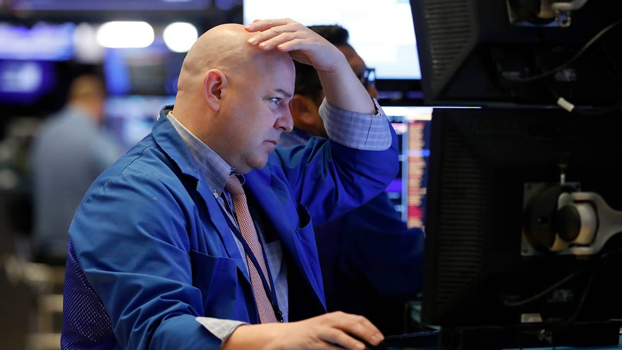 Photo of a trader working on the floor of the New York Stock Exchange