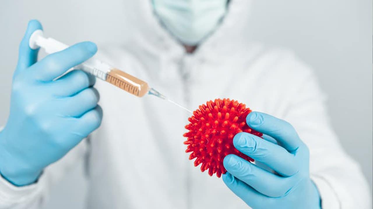 Photo of a doctor with a vaccine