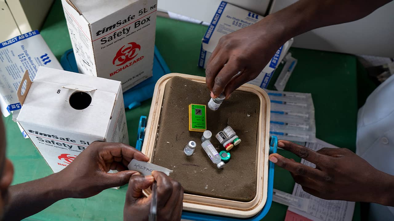 Photo of health officials preparing vaccines 