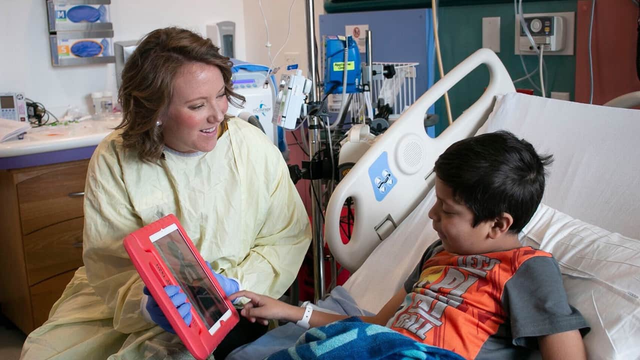 Photo of a child life team member and a Valley Children's Hospital patient