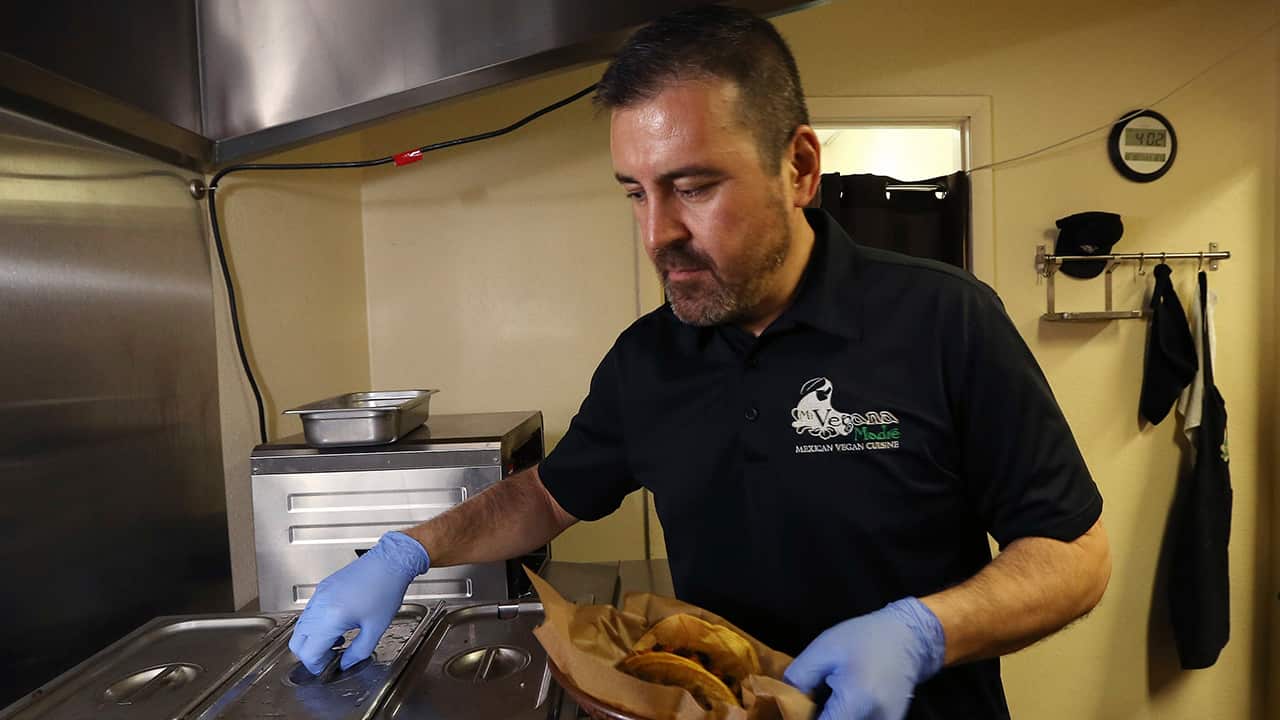 Photo of Jose Gamiz preparing vegan tacos