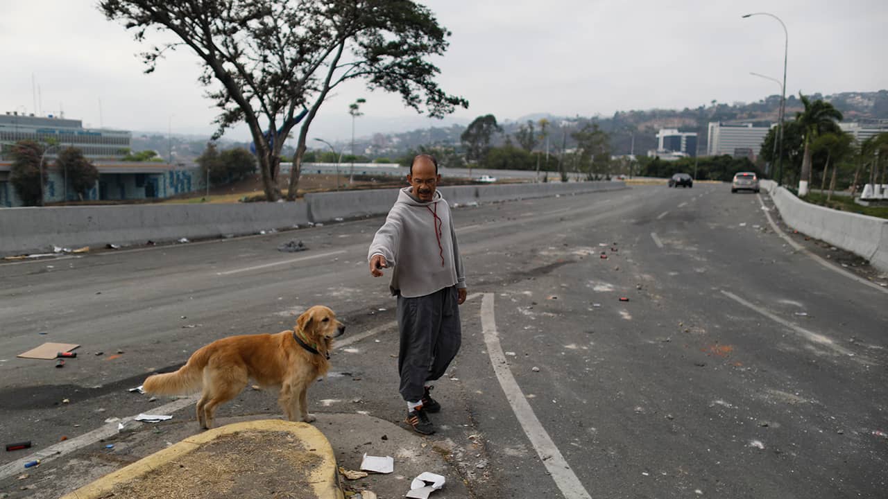 Photo of a man walking his dog in Venezuela