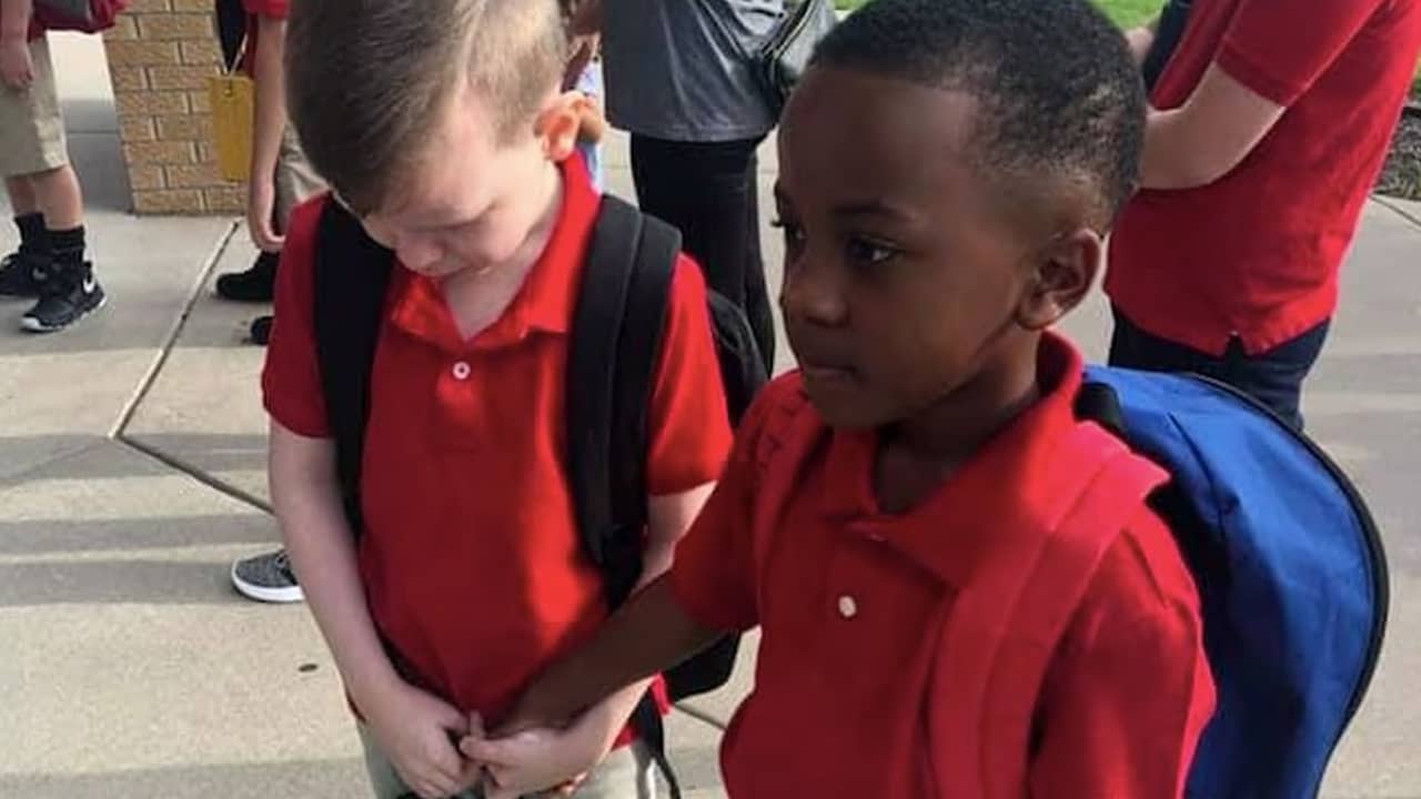 Photo of two kids holding hands