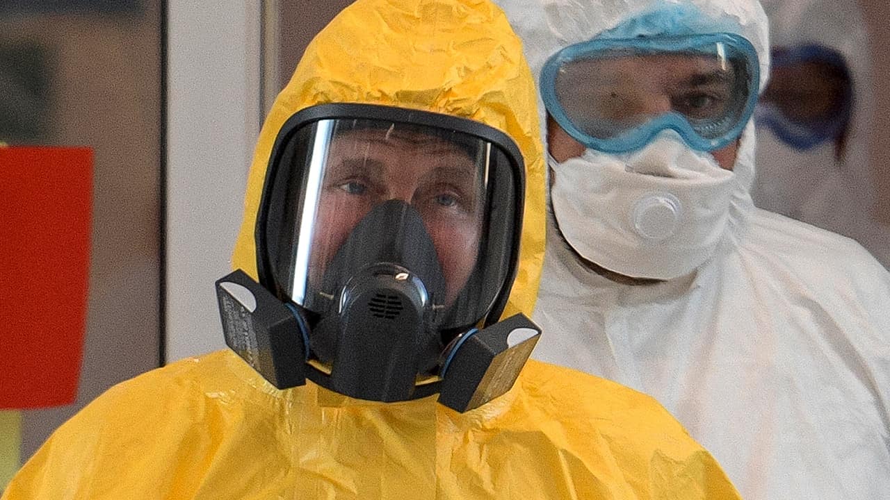 Photo of President Vladimir Putin wearing a protective suit