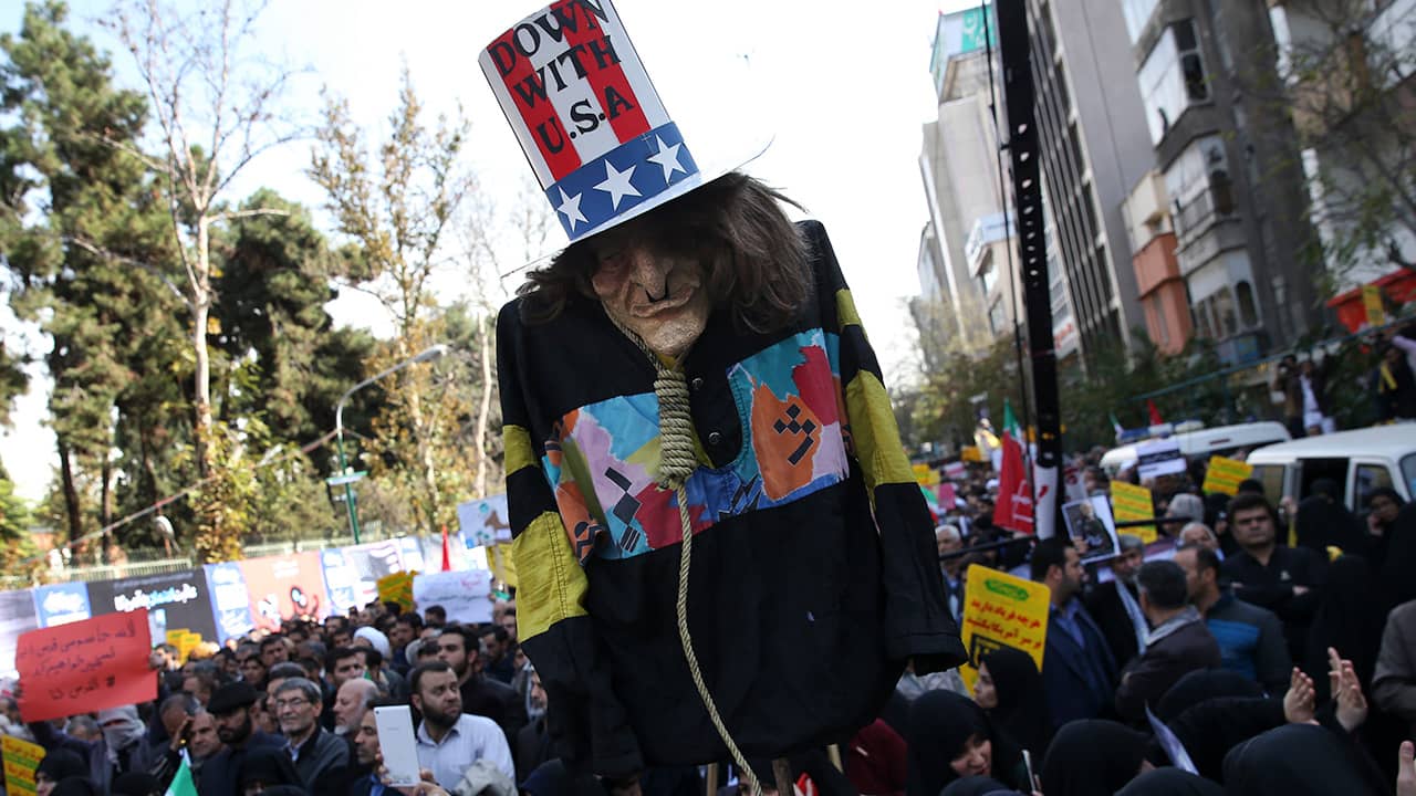 Photo of "Uncle Sam" being held up by demonstrators during a rally in Iran