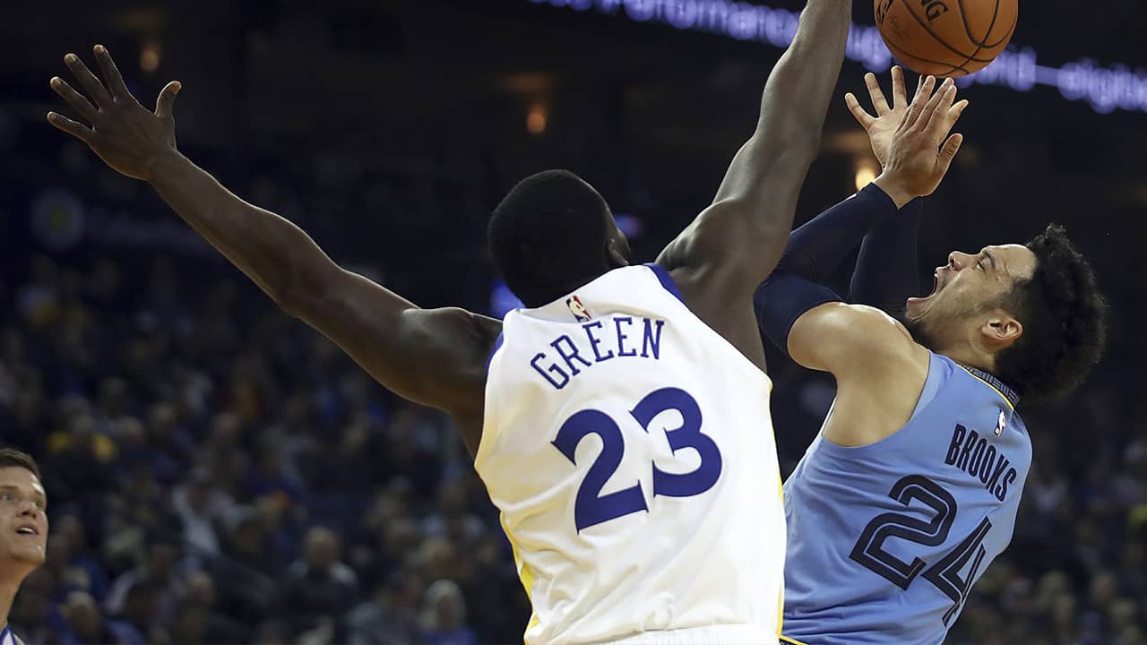Photo of Memphis Grizzlies' Dillon Brooks and Golden State Warriors' Draymond Green