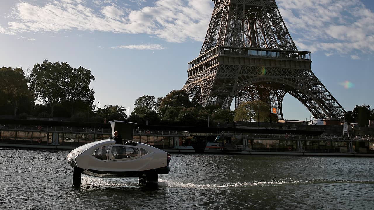 Photo of a SeaBubble going past the Eiffel Tower in Paris
