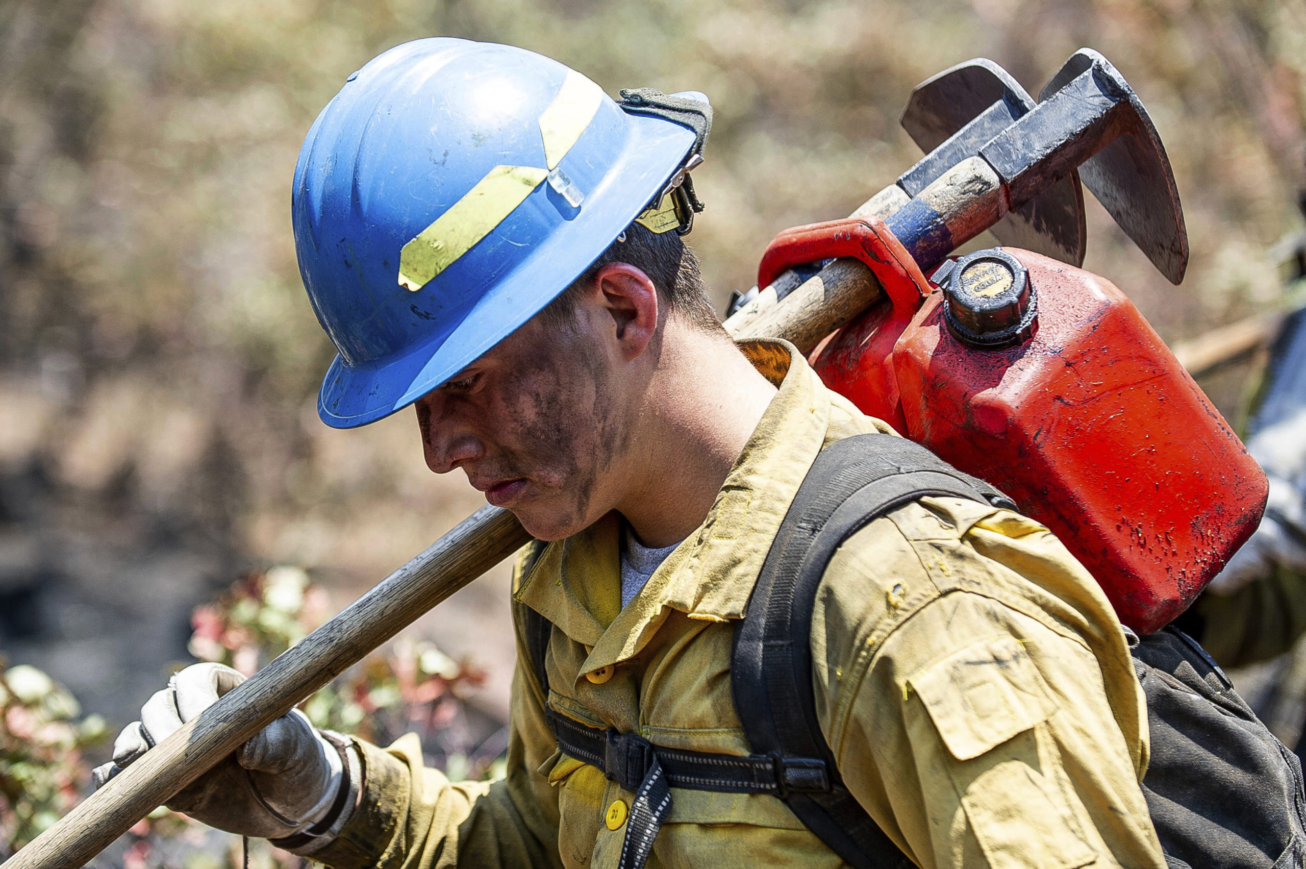 Photo of a "hot shot" firefighter carrying his gear