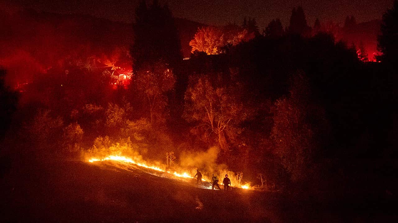Photo of firefighters working to contain a wildfire in Moraga, Ca.