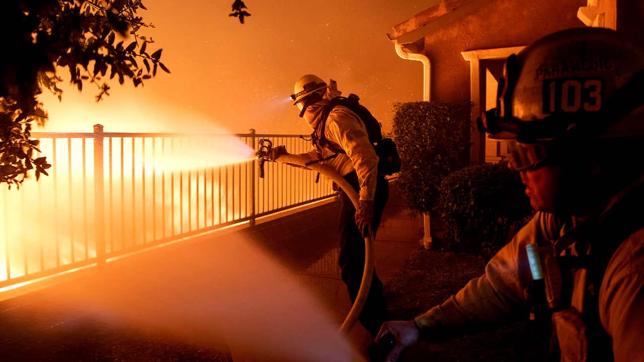 Photo of LA County firefighters battle the Saddleridge fire