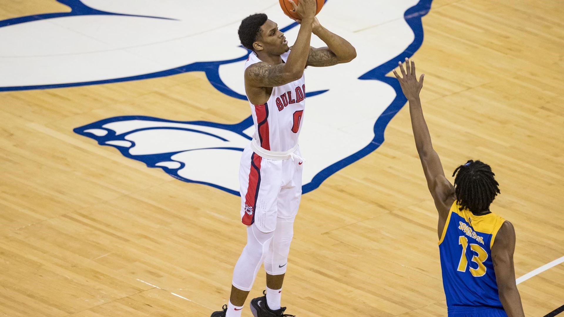 Fresno State's New Williams launches a 3-point shot against San Jose State