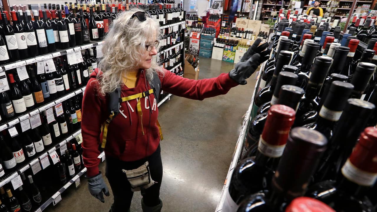 Photo of a woman shopping for wine 