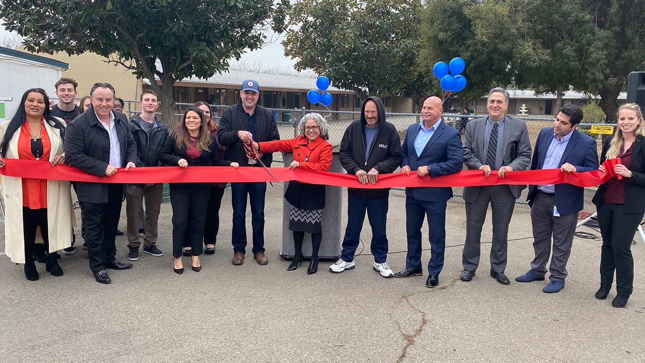 Photo of ribbon cutting for the RH Community Builders Winter Warming Shelter