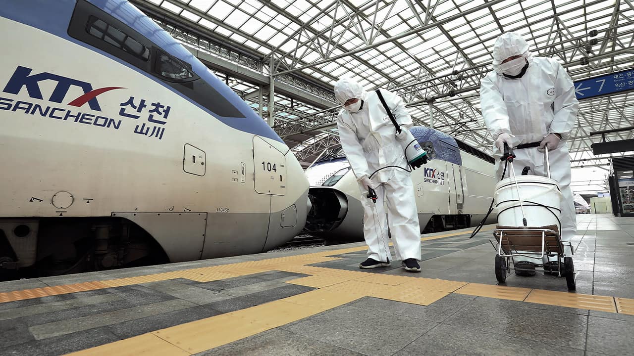 Photo of workers disinfecting the Seoul Railway Station in South Korea
