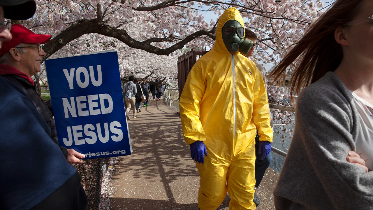 Photo of a teenager wearing a hazmat suit 
