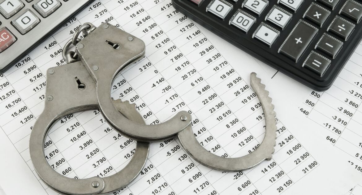 Image of handcuffs, expense lists, and calculators symbolizing fraud