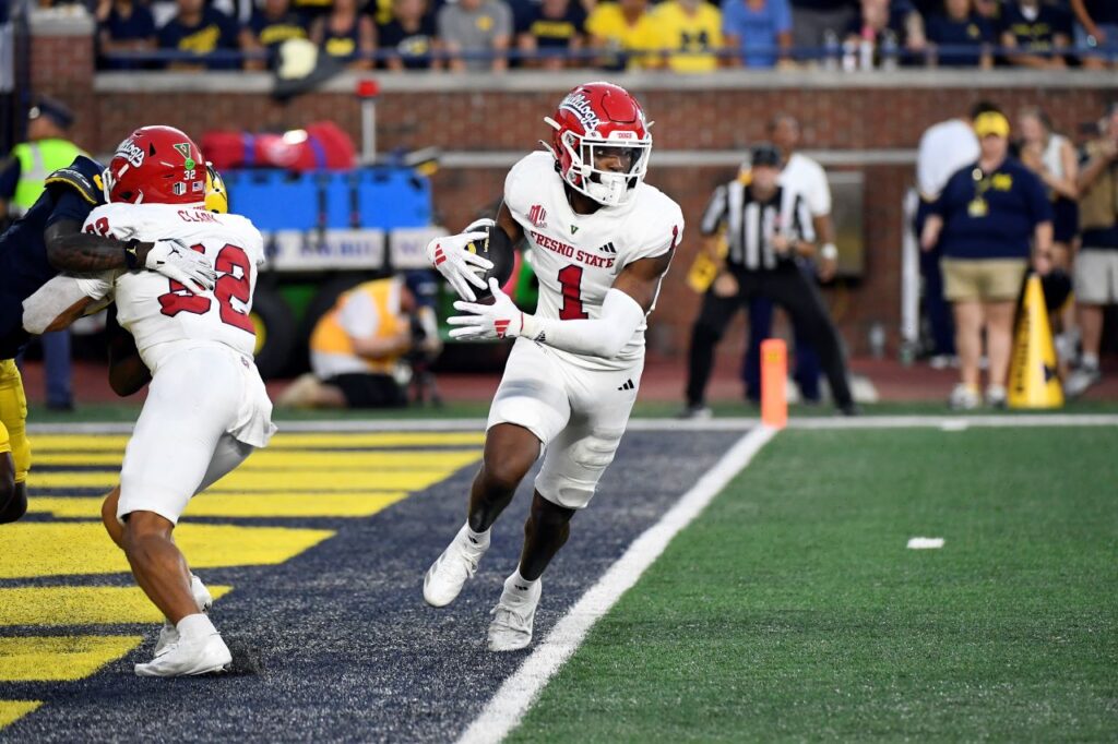 Fresno State defensive back Cam Lockridge intercepts a pass and runs with the ball against Michigan in the first half of an NCAA college football game, Saturday, Aug. 31, 2024, in Ann Arbor, Mich. (AP/Jose Juarez)